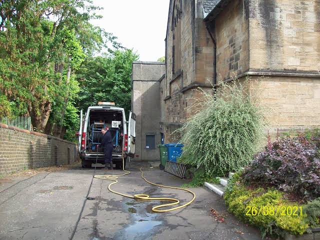 Drain inspection technician with equipment